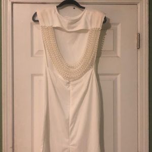 👛 Women’s Dress with pearl drape on the back.